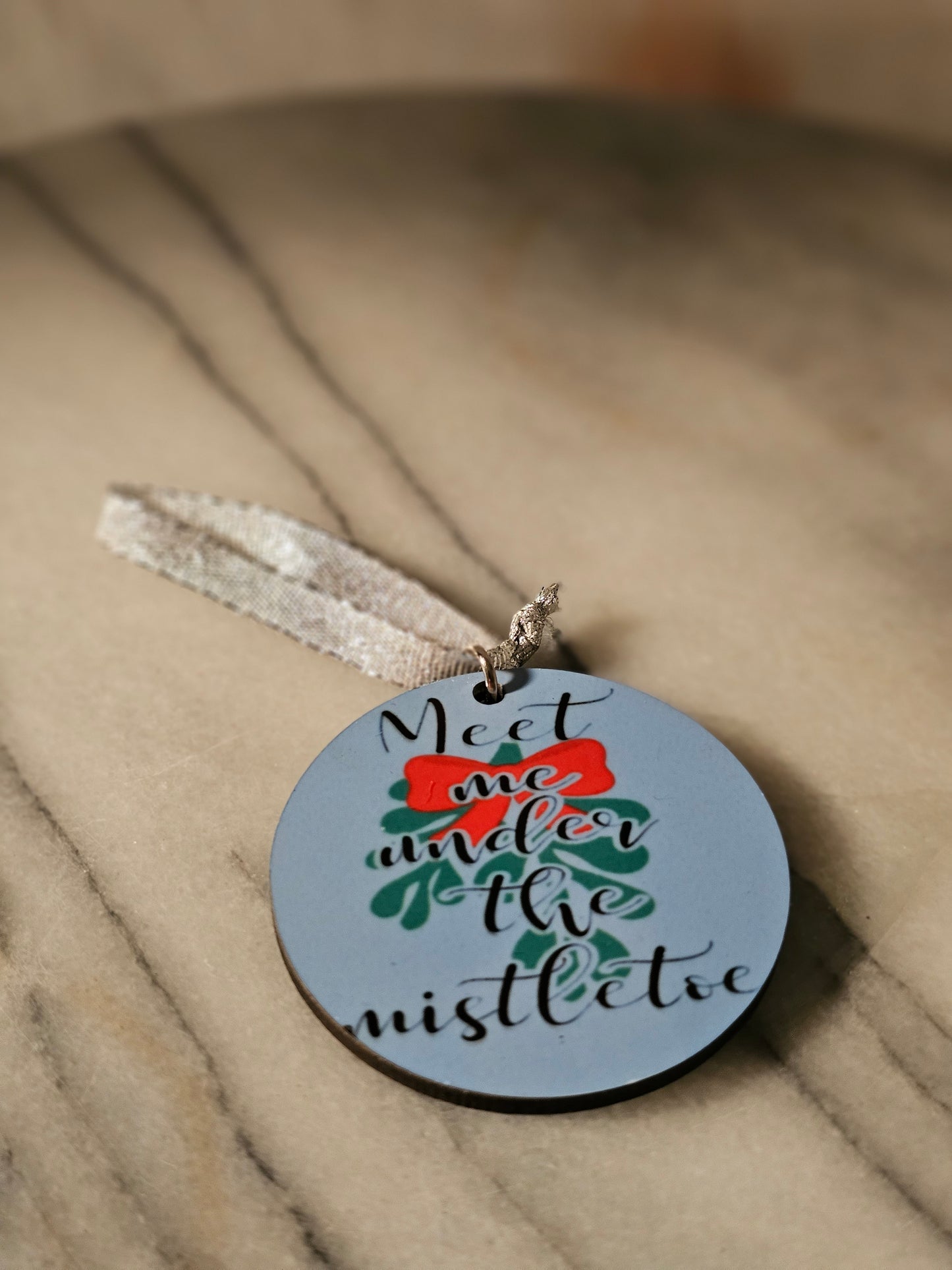 2 inch sublimation Meet me under the mistletoe Christmas oranment.