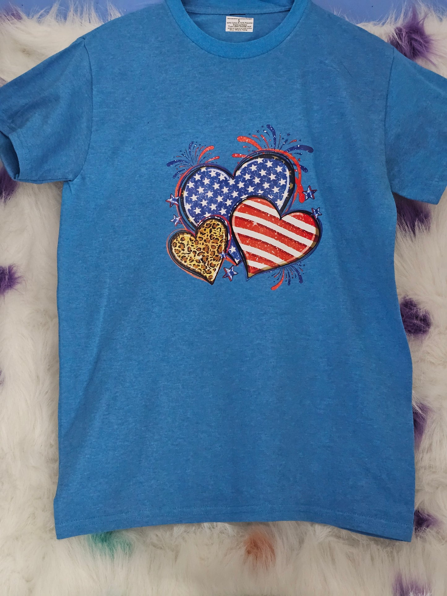 Size S 50% cotton 50%polyester Blue shirt with hearts