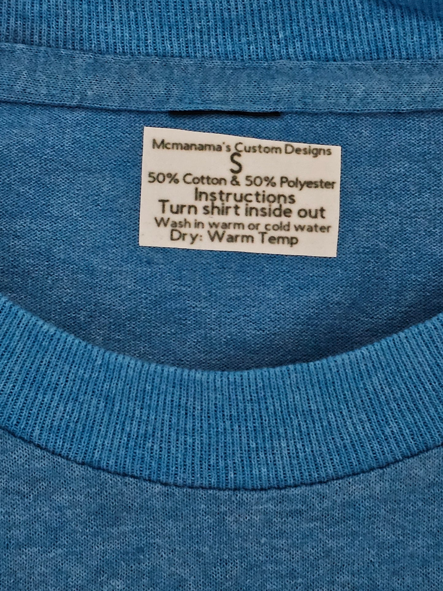 Size S 50% cotton 50%polyester Blue shirt with hearts