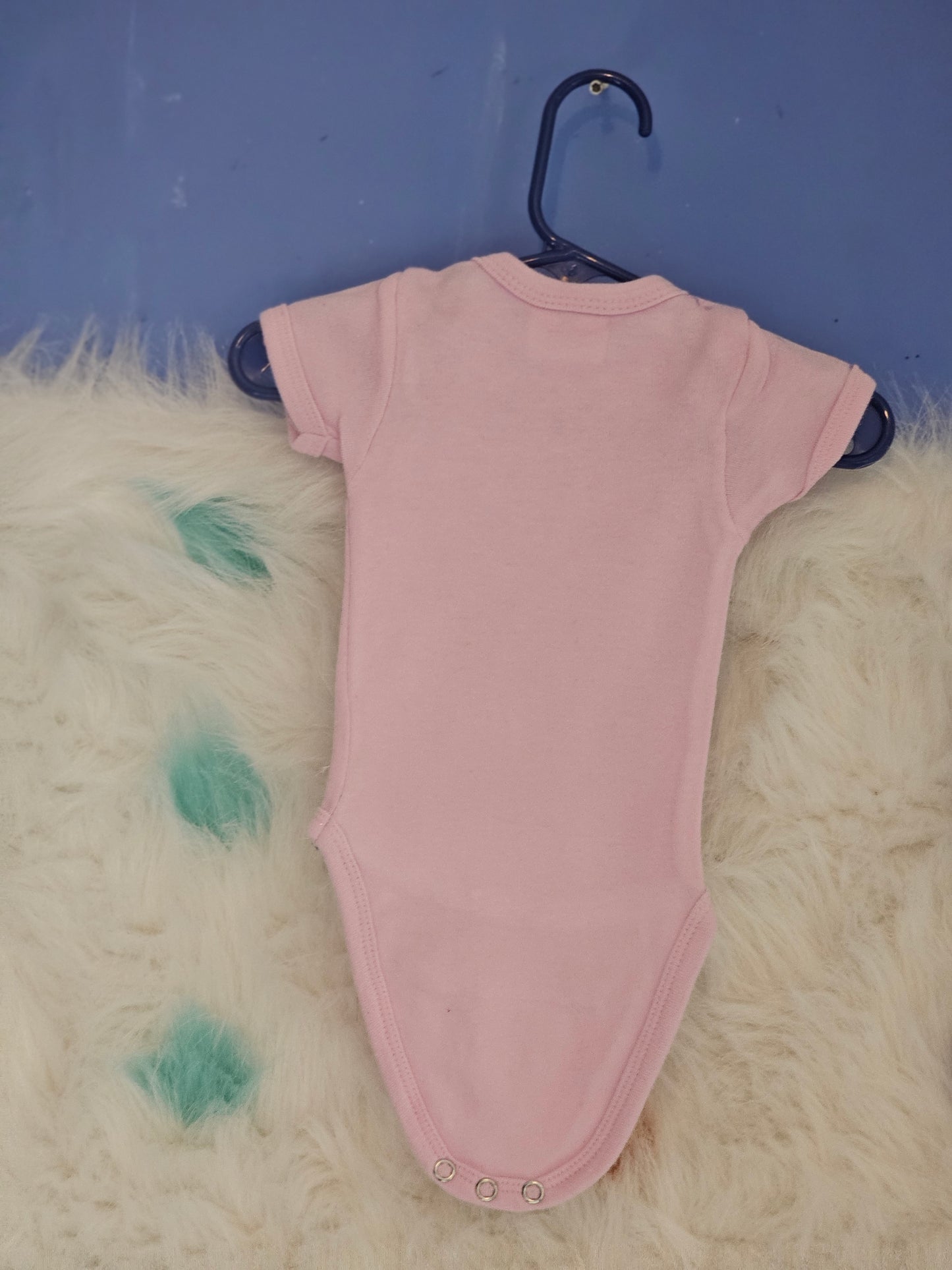 Size new born pink onesie