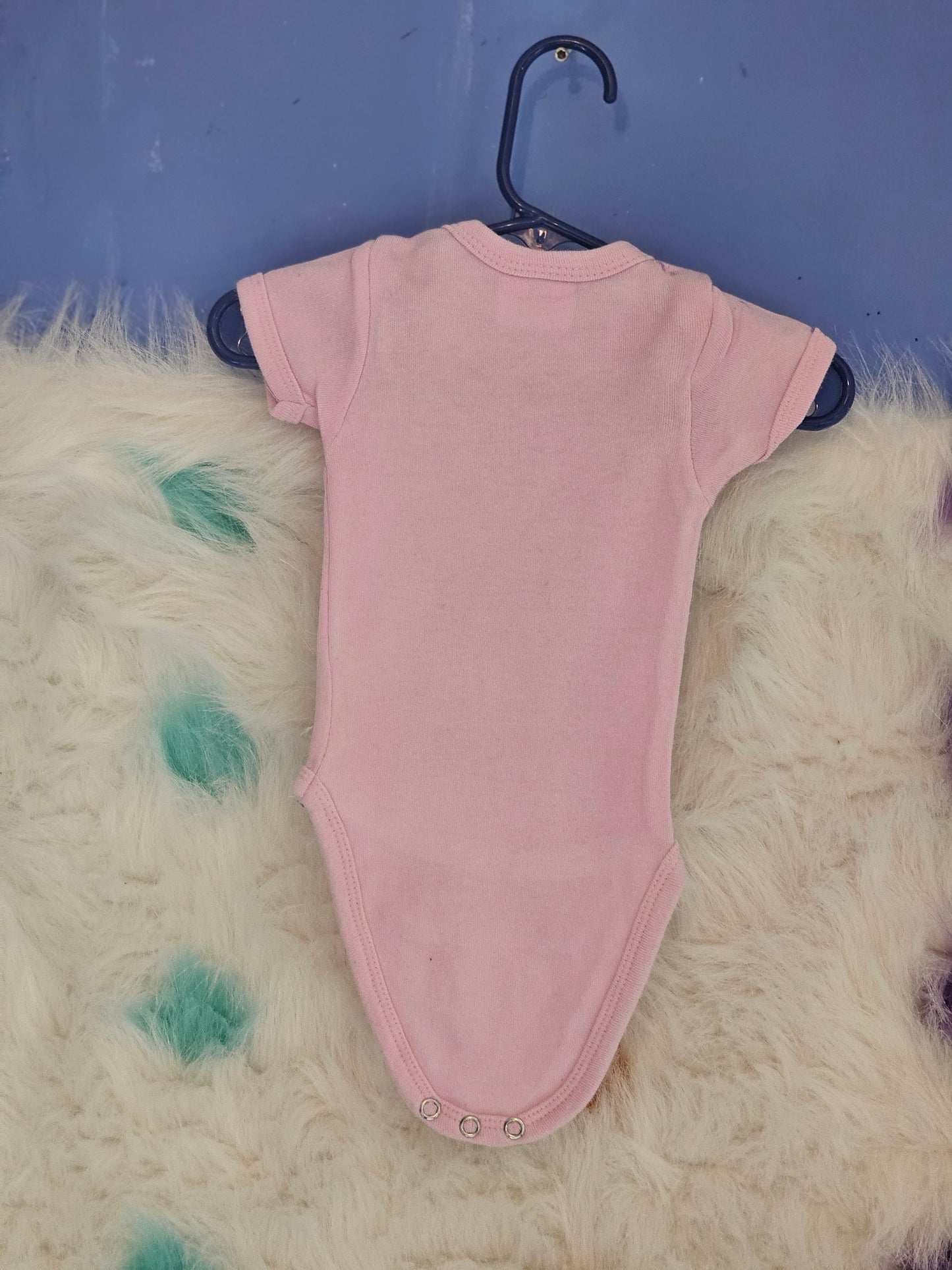 Size new born pink onesie