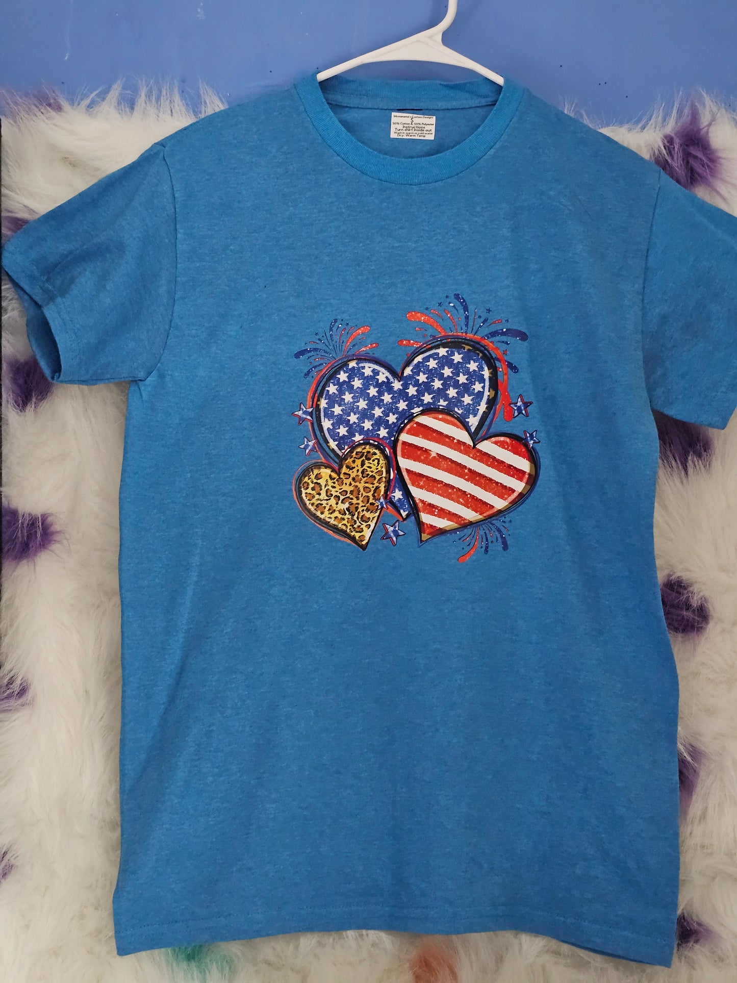 Size S 50% cotton 50%polyester Blue shirt with hearts