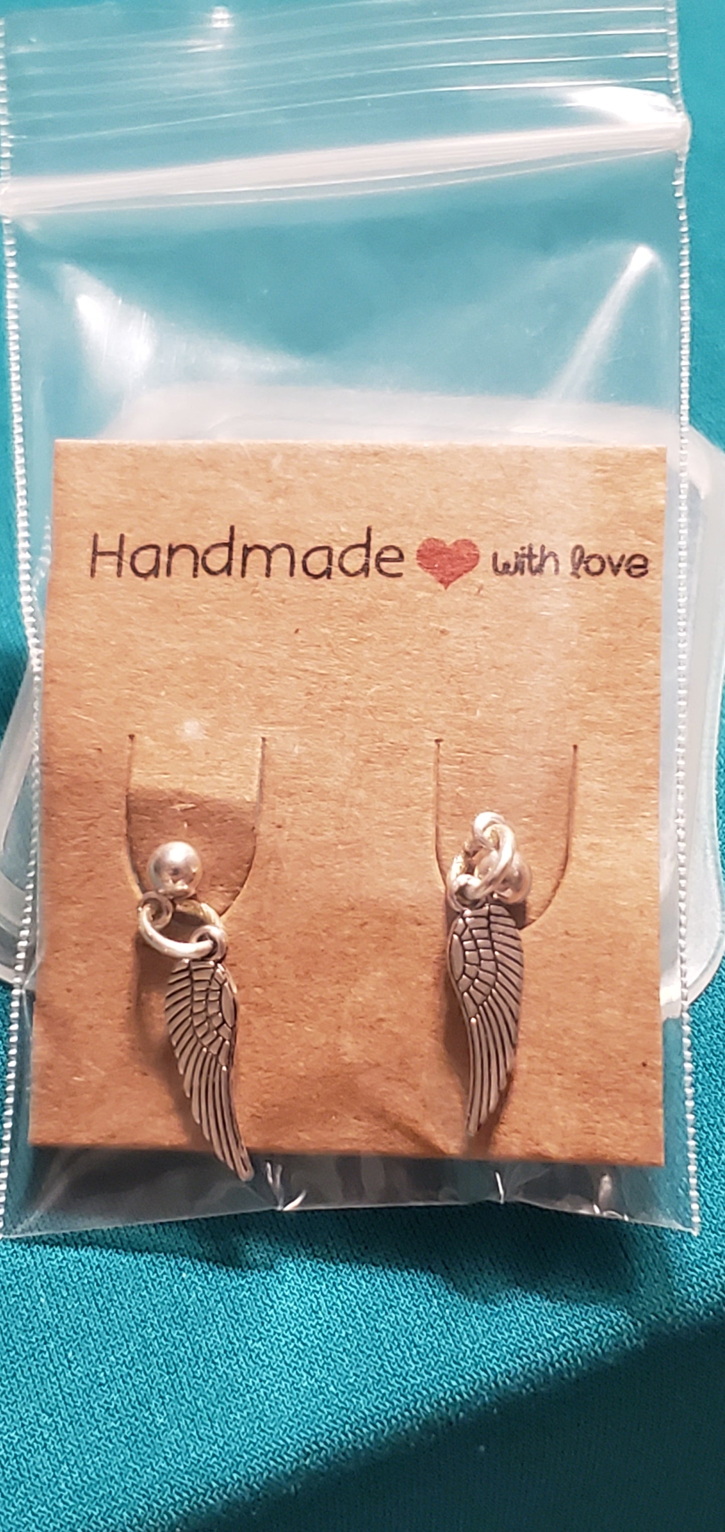 Stainless steel silver plated angel wings post earrings