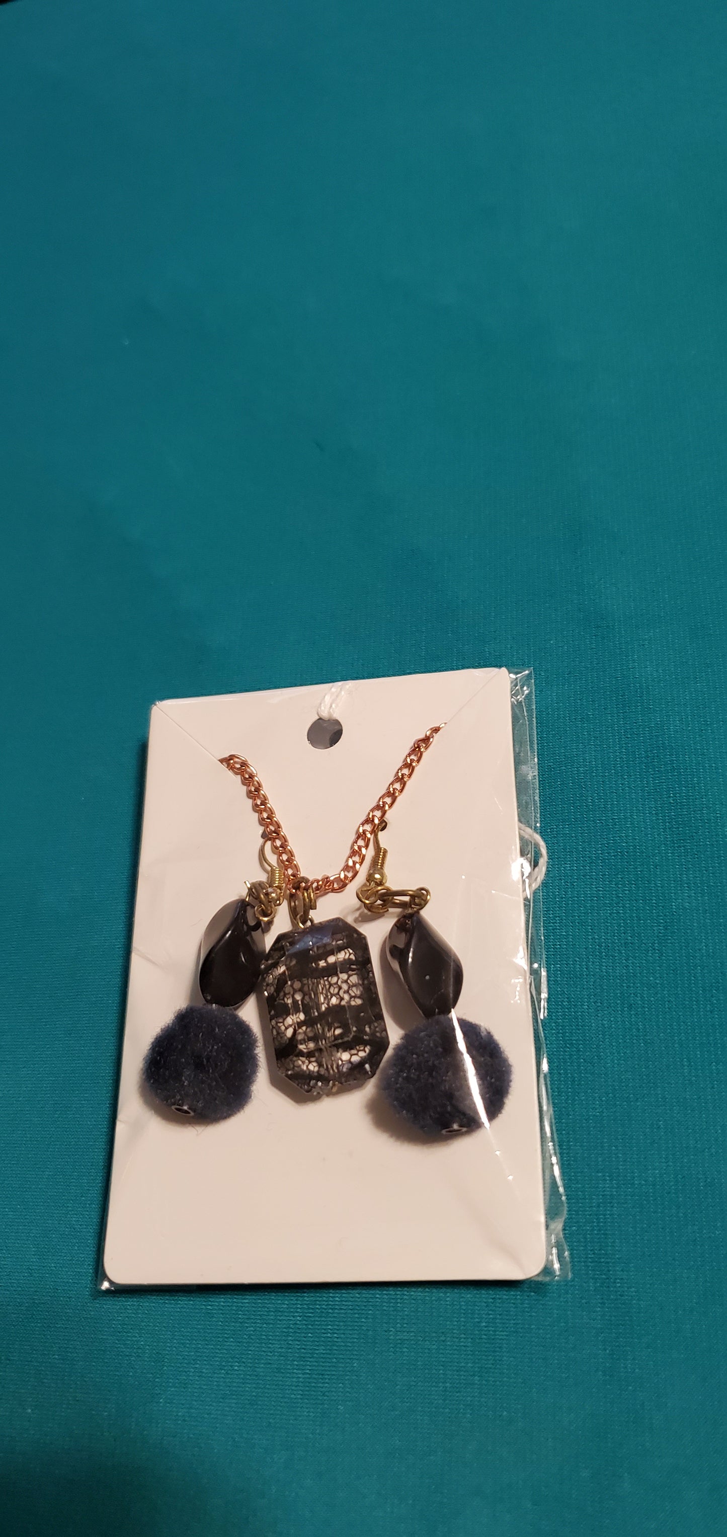 Gold plated black charm on necklace and nugget on earrings