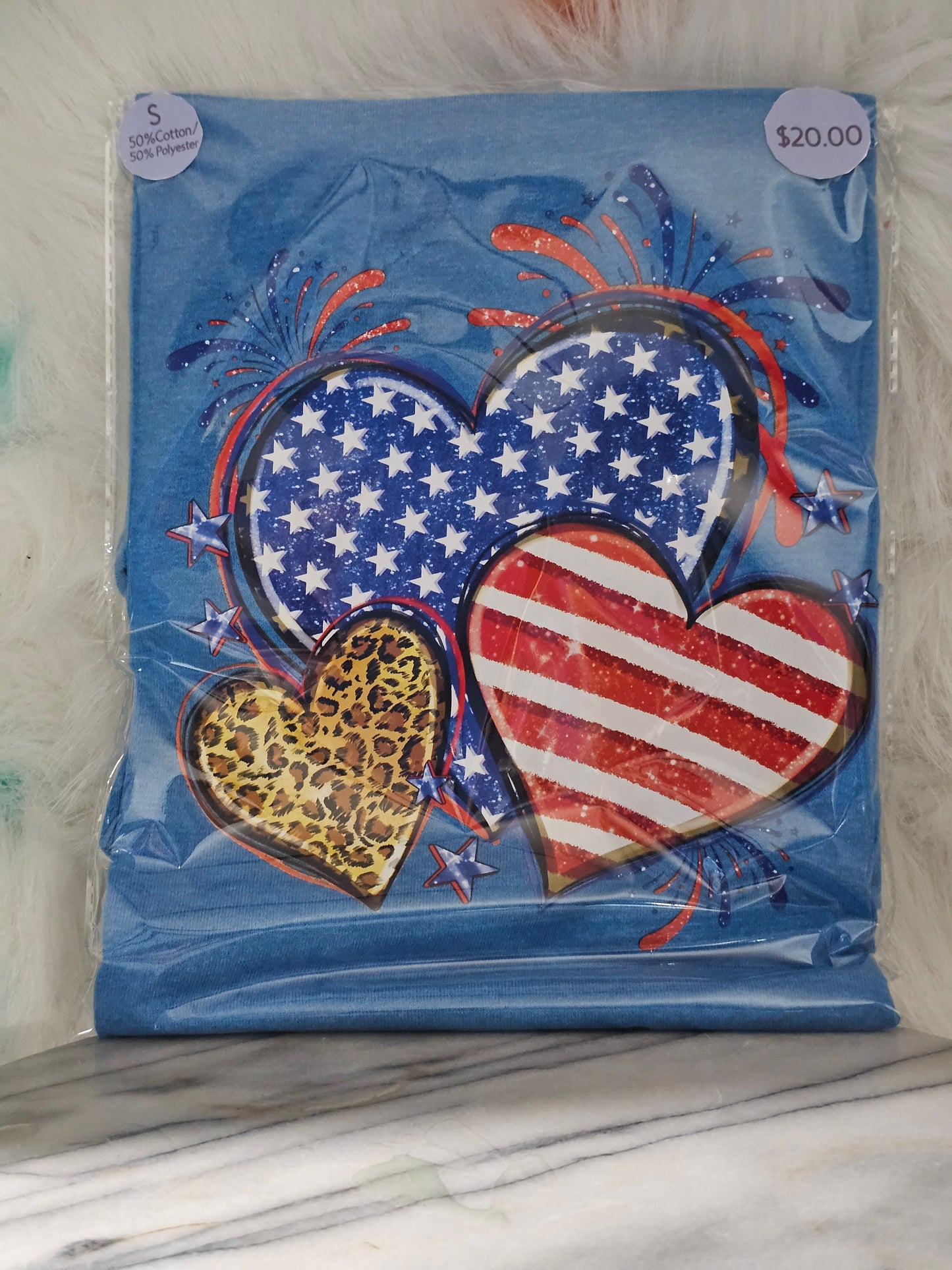 Size S 50% cotton 50%polyester Blue shirt with hearts