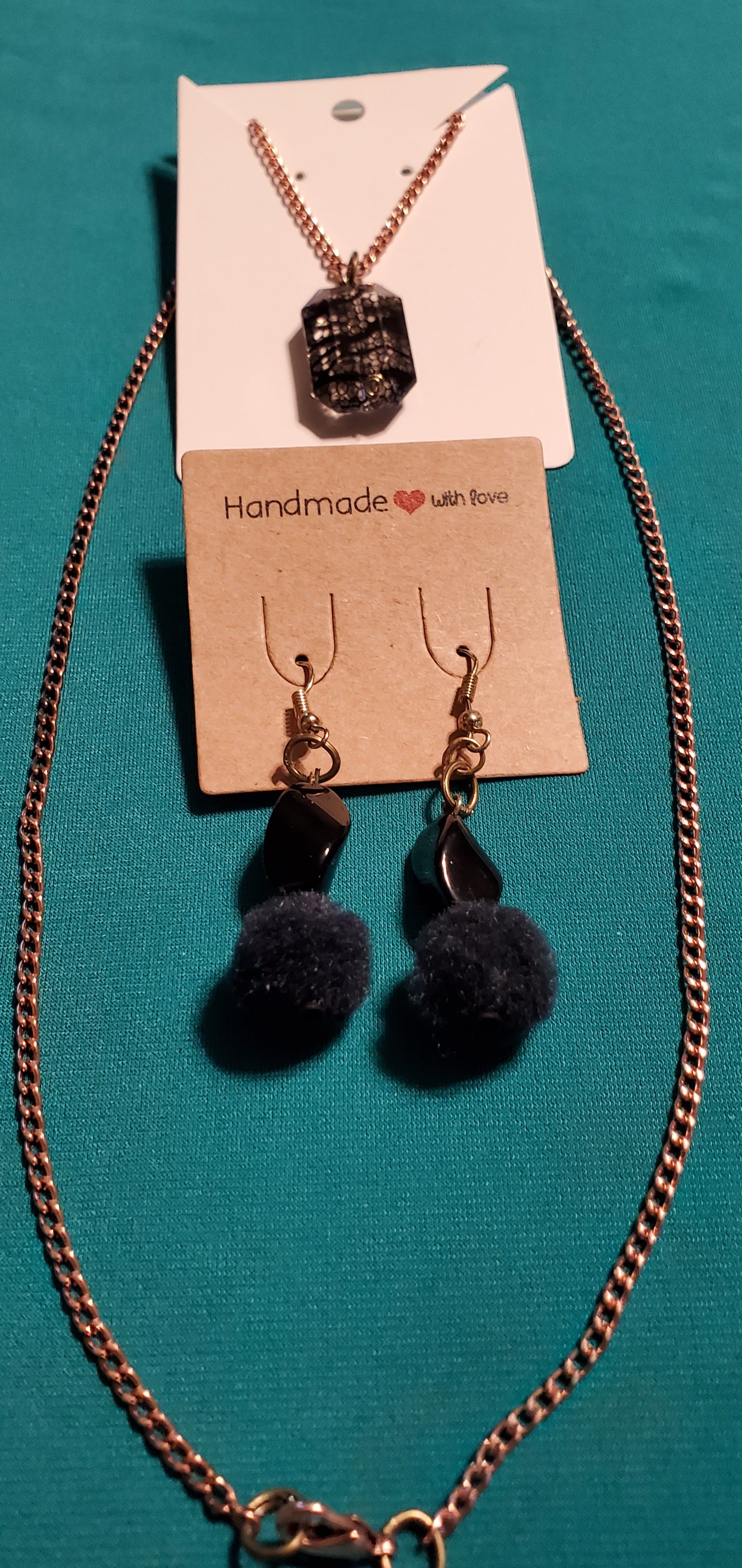 Gold plated black stars and fuzzy balls necklace and earrings