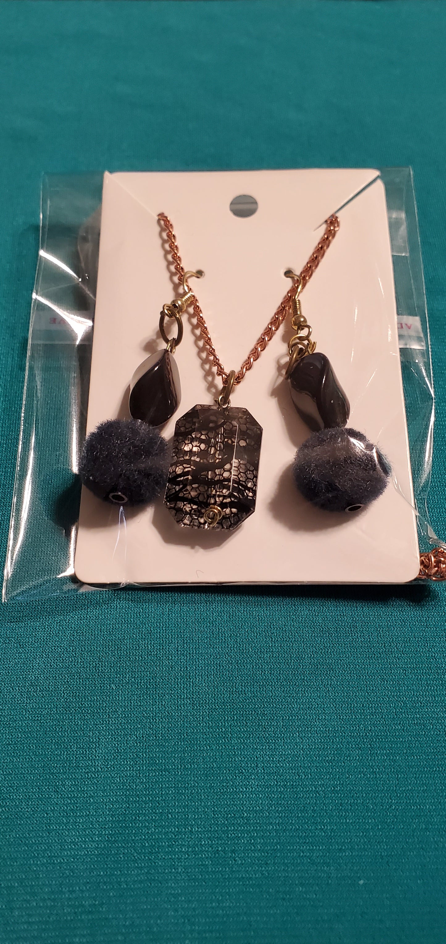 Gold plated black stars and fuzzy balls necklace and earrings