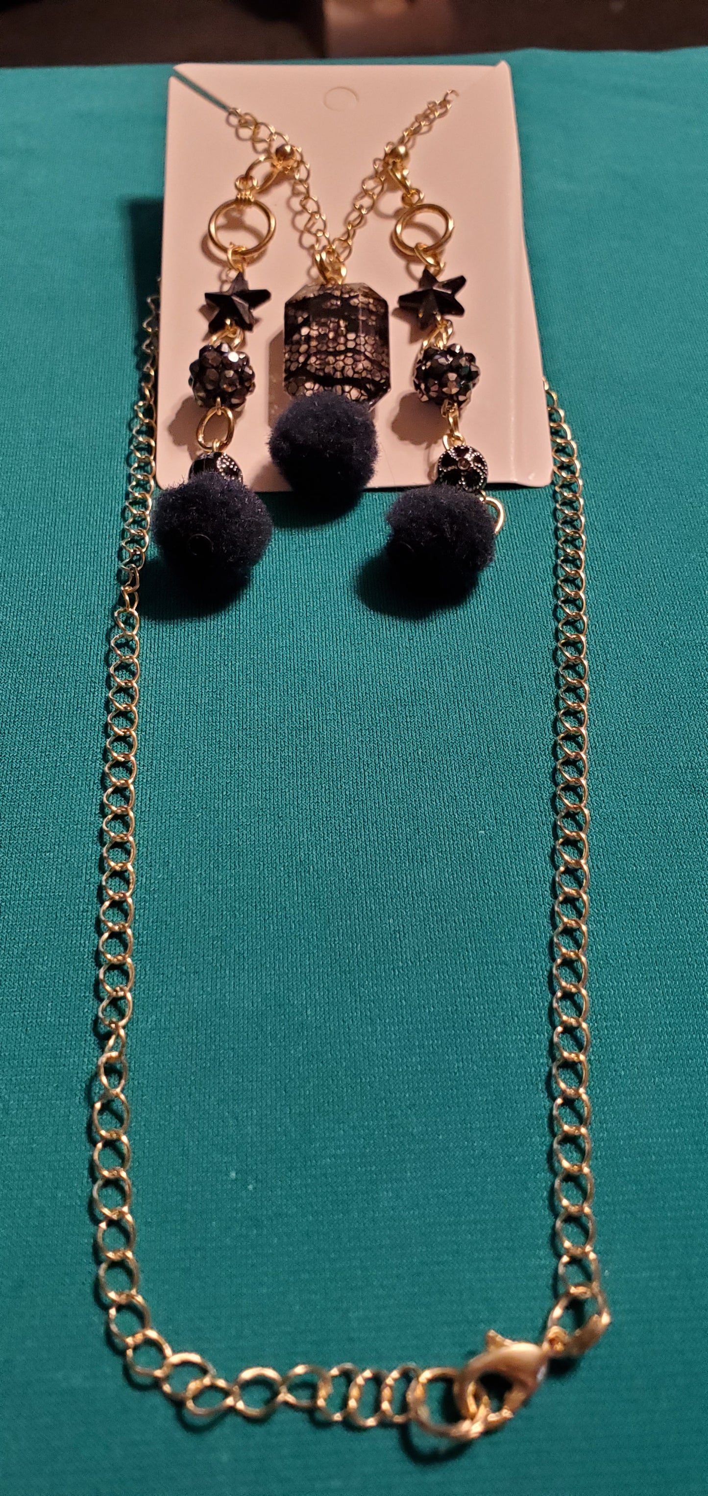 Gold plated black stars and fuzzy balls necklace and earrings