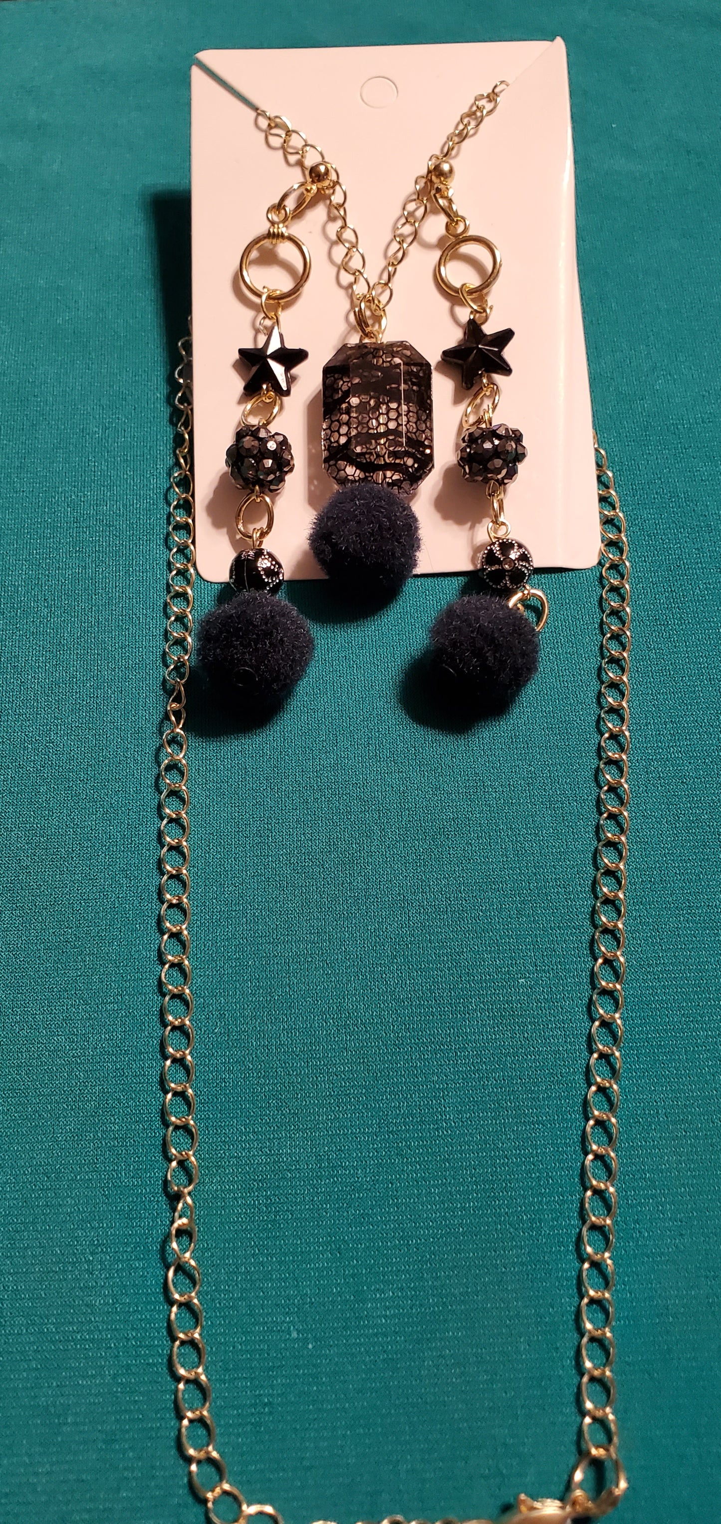 Gold plated black stars and fuzzy balls necklace and earrings