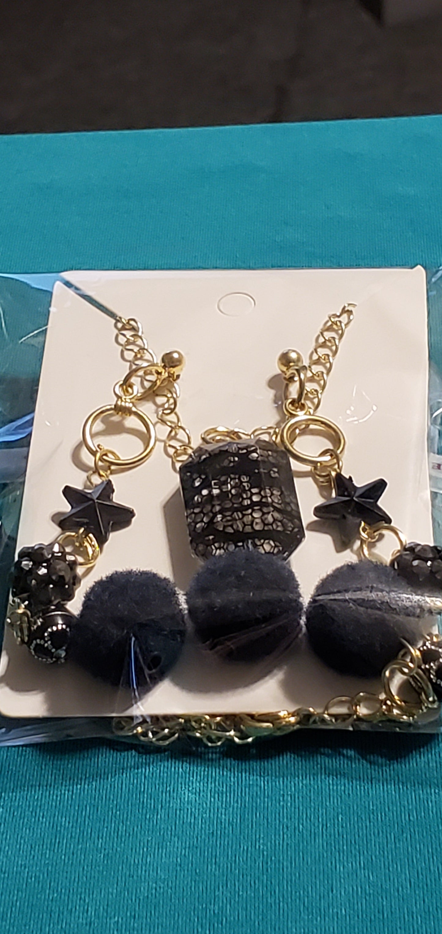 Gold plated black stars and fuzzy balls necklace and earrings