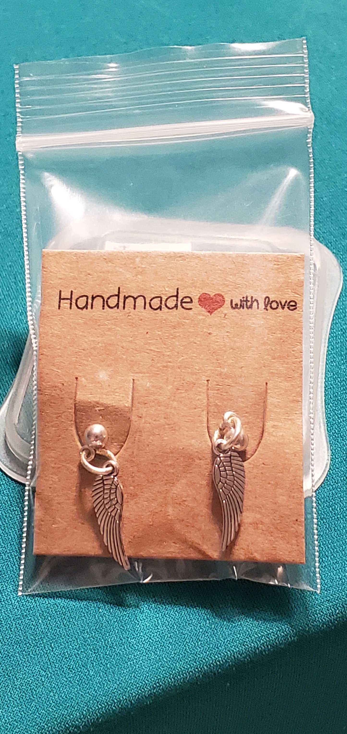 Stainless steel silver plated angel wings post earrings